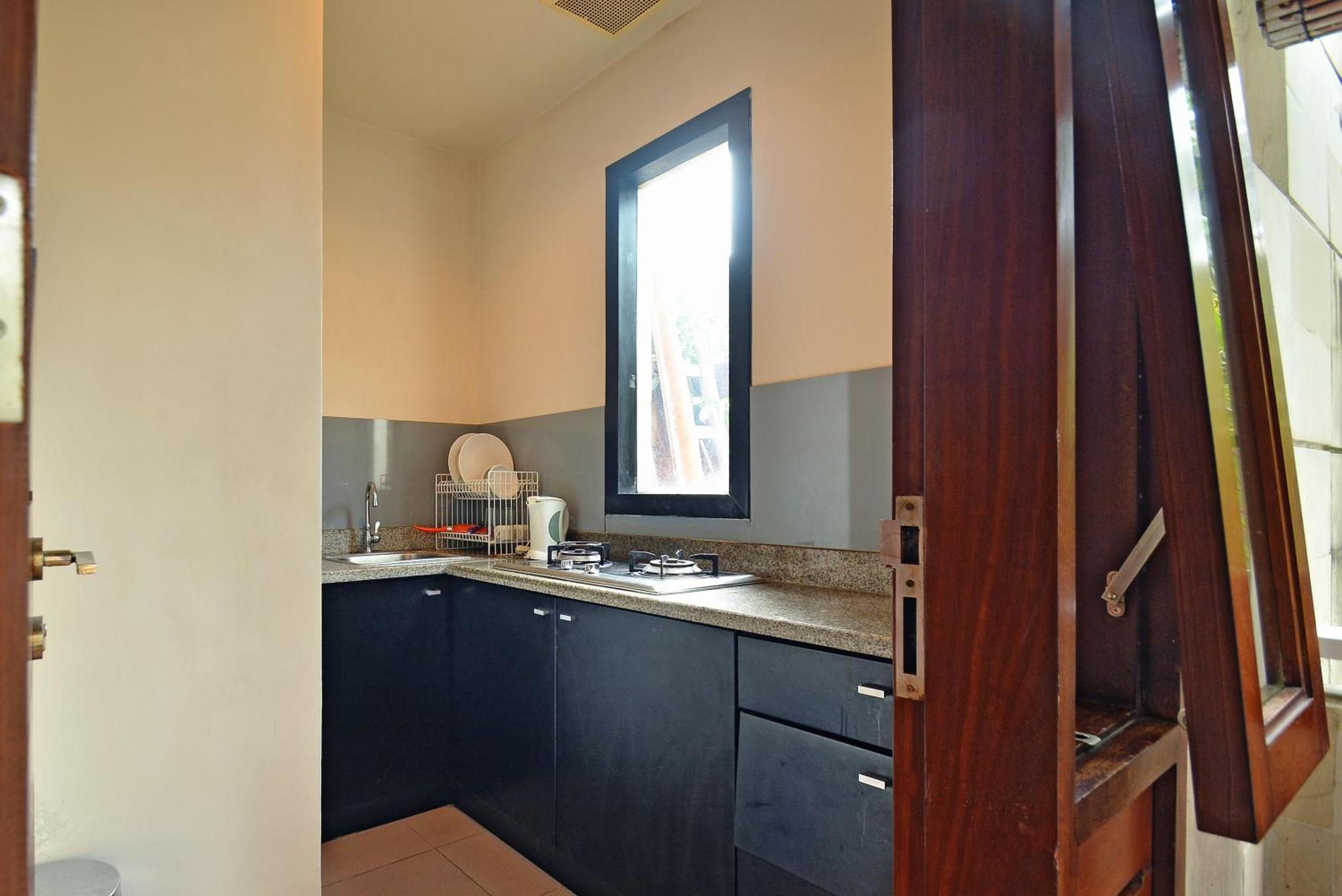 Taman Ayu Town House Aparthotel Legian Quarto foto